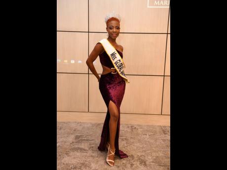  Miss Global Jamaica Pickqueena Burrell stood tall in her mauve, velvet asymmetrical cutout gown.