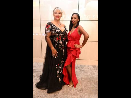 RB Cooling Methods President Monique Edwards-Kong (left) and Vice-President Aliyah Bansie made sure, as sponsors, that their presence was felt, and then some.