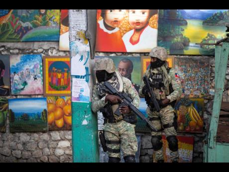 In this July 2021 photo, soldiers patrol in Petion Ville, the neighbourhood where the late Haitian president, Jovenel Moïse, lived in Port-au-Prince, Haiti.