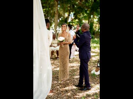 The bride and groom engage in a high-spirited wedding ceremony. 