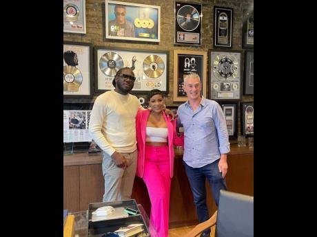 Credit: Instagram @mslegendary From left: Producer Skatta Burrell, dancehall artiste Ishawna and Payday Record's Patrick Moxey, following Ishawna's signing to Payday Records.