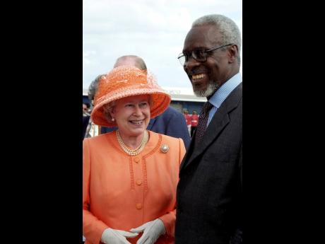Credit: File Queen Elizabeth II (left) and then Prime Minister P.J. Patterson share broad smiles in 2002.