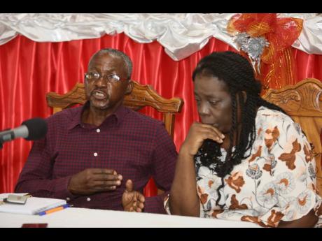 Jacqueline Bulgin is in a pensive mood on Thursday as the Reverend Keith Bulgin shares memories of their sons, Tavaughn and Tavaris, who died in the United States last month. The occasion was a press conference at the Palmers Cross New Testament Church of 