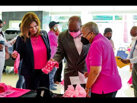 Samantha Samuda (left), vice-president, marketing, distribution and human resources, at the Insurance Company of the West Indies (ICWI); Carolind Graham (right), chairperson of Jamaica Reach To Recovery and Michael Leslie, acting executive director of the 