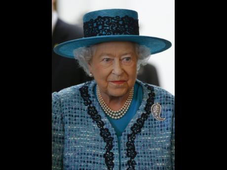 Credit: File This February 2015 photo shows Britain’s Queen Elizabeth II smiling during a visit to reopen Canada House on Trafalgar Square in London.