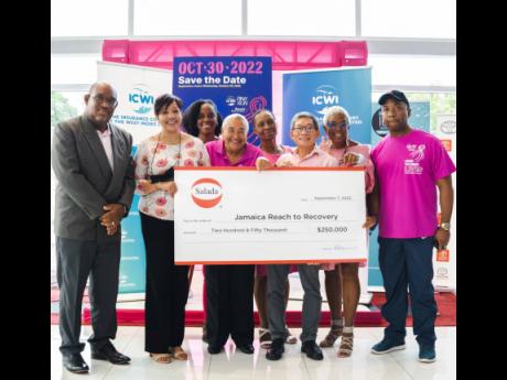 Salada Foods Jamaica shows its support for Jamaica’s Breast Cancer Awareness movement with a cheque valued at $250,000 during the ICWI/Jamaica Reach to Recovery Pink Run 5K launch on September 7 in Kingston. Salada Foods General Manager Tamii Brown (thir