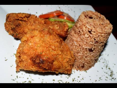The fried chicken, which struck a beautiful balance between tender and crispy, paired perfectly with rice and peas and vegetables. 