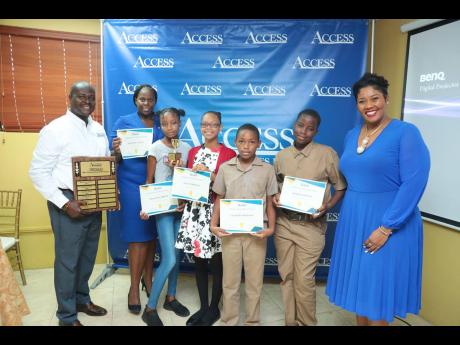 From left: Access Financial Services (AFS) Chief Executive Officer Frederick Williams; business loan officer and grant recipient Shantel James; scholarship award recipients Chana-Kay Brown, Anya Cobourne, Caleb Henderson, and Hayden Spence; and AFS awards 