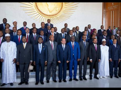 In this February 2019 photo African heads of state pose for a group photo during the opening of the 32nd Ordinary Session of the Assembly of the Heads of State and the Government of the African Union (AU) in Addis Ababa, Ethiopia.