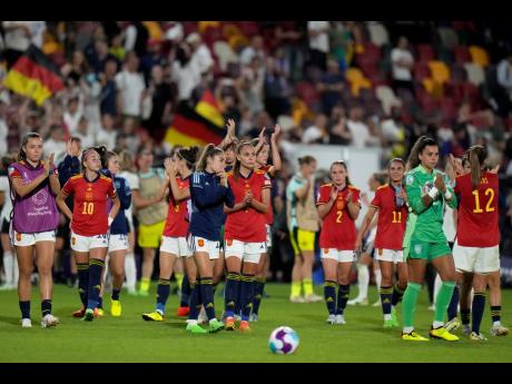 Credit: AP Spain’s players applaud the fans at the end of a Women’s Euro 2022 Group B match against Germany on July 12, 2022, in London. Germany won 2-0.
