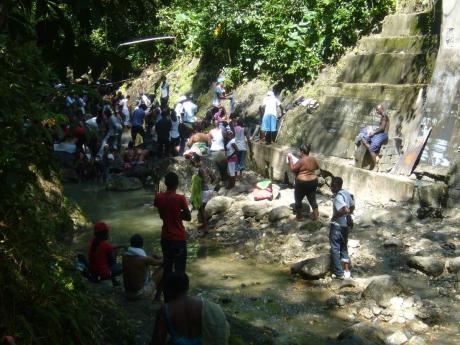 Credit: Ian Allen People relaxing at the hot springs in Bath, St Thomas.