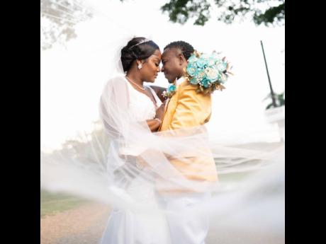 The newly-wedded couple were almost lost to the camera, as they stared in each other’s eyes.