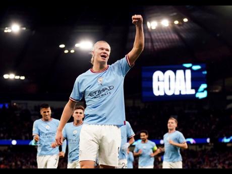 Manchester City’s Erling Haaland celebrates after scoring his side’s opening goal during a Champions League football match against FC Copenhagen at the Etihad stadium in Manchester, England, yesterday.
