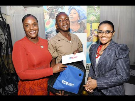 Claudine Allen (left), general manger of JN Foundation, with Daniel Gregory and his mother Ruth-Ann Blake after he was presented with his JN Money grant at the JN Foundation Primary Exit Profile (PEP) scholarship awards ceremony held at the Terra Nova All 