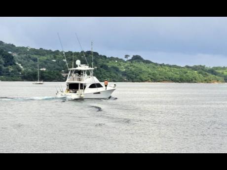 Credit: Gareth Davis Sr A boat venturing out to sea at the start of the 2022 Mayberry Superstars Blue Marlin tournament in Port Antonio yesterday.