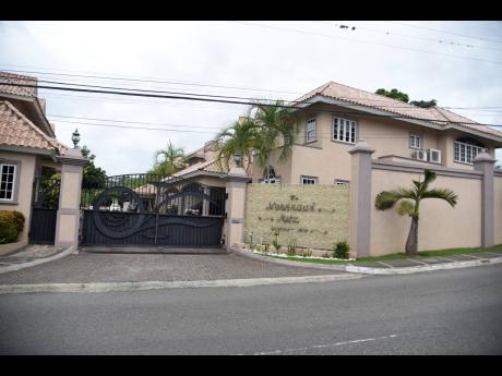 A penthouse suite and two apartments nestled in the upper-class neighbourhood of Norbrook, St Andrew, and a mansion in Ironshore, St James, are among some two dozen assets, worth a little more than $500 million, Hamilton recently forfeited to the Governmen