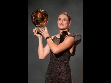Barcelona's Alexia Putellas celebrates after winning the women's Ballon d'Or.