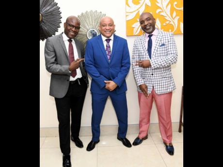 Credit: Rudolph Brown Mark Chisholm, chief revenue officer of insurance at Sagicor, is flanked by Leighton Morgan (left), agency manager, and Sean Edwards, director of sales.