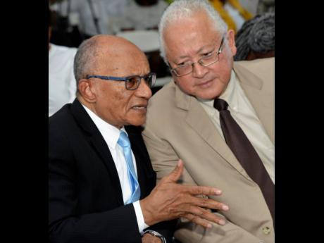Professor Trevor Munroe (left), principal director, National Integrity Action, and Justice Minister Delroy Chuck.