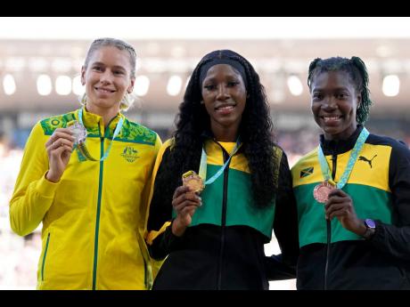 High jumper Kimberly Williamson (right) with the bronze medal she won at the 2022 Commonwealth Games in Birmingham, England.  At centre is gold medallist Lamara Distin, while at left is  silver medallist Eleanor Patterson of Australia.