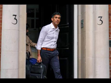Conservative Party leadership candidate Rishi Sunak leaves his campaign office in London on Sunday. The former British Treasury chief is the front-runner in the Conservative Party’s race to replace Liz Truss as prime minister. 