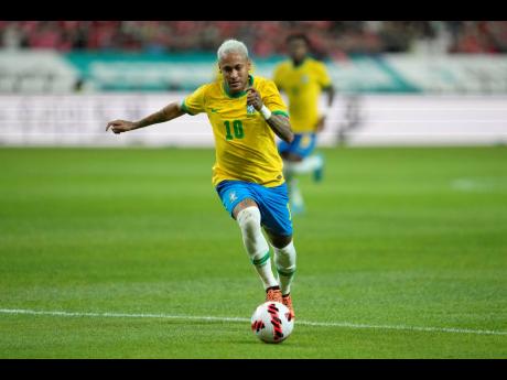 Brazil’s Neymar dribbles the ball during a friendly match between South Korea and Brazil at Seoul World Cup Stadium in  on Thursday, June 2, 2022. 