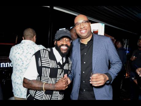 Credit: Contributed Our lens captured Tarrus Riley (left) and Delano Seiveright, senior government adviser and communications strategist.