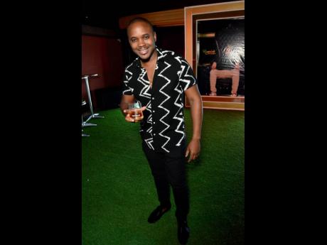 Credit: Contributed J. Wray & Nephew’s Kamal Powell kept things casual at Romeich’s 38th birthday celebration.