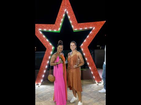 Credit: Contributed Drs Meshel McIntosh (left) and Lisa Beck-Samuels traded in their dental scrubs for elegant maxi and midi dresses.