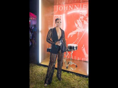 Credit: Contributed Fierce and fabulous Latesha Ramcharan-Mullings looked stunning in this sheer accent-tailored suit paired to perfection with black Valentino heels and a Prada bag to match.