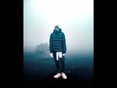 Dixon in a knitted jacket, pants and balaclava from CP Company’s new sportswear collection.