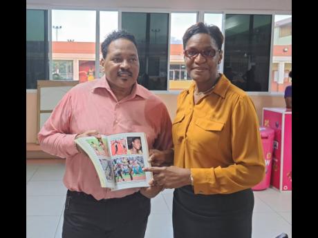 Co-author Michael Grant and Olympian Deon Hemmings McCatty at Thursday’s launch of the book, ‘Fifty Days Afire: Inside Jamaica’s Long Sprint to Freedom.’ 