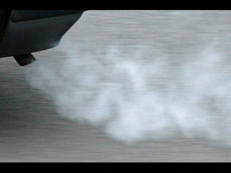 FILE - A view of the exhaust pipe of a car in Erfurt, Germany, Jan. 26, 2009. The European Parliament and EU member countries have reached a deal to ban the sale of new gasoline and diesel cars and vans by 2035. EU negotiators sealed on Thursday, Oct. 27, 