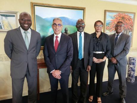 Clive Blackwood, executive vice president and general auditor of the Federal Reserve Bank of New York (centre) and his wife Sandra Blackwood (second right) made a courtesy call on Bank of Jamaica governor Richard Byles (second left) on Thursday, November 3