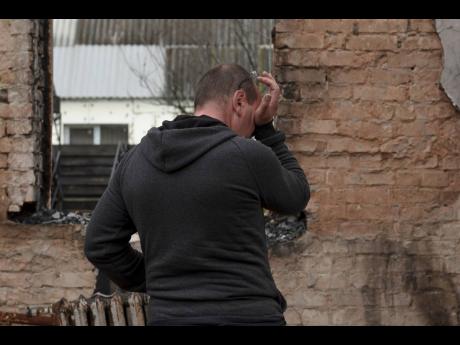 Credit: AP
Vadym Zherdetsky reacts standing in the remains of his destroyed house in the village of Moshun, outside Kyiv, Ukraine, on Friday, November 4.