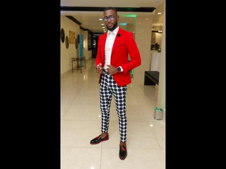 Financial adviser Fabian Gordon dazzles in his black, red and white ensemble at the Sagicor Life High Flyers luncheon.