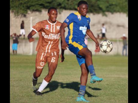 Credit: Photo by Lennox Aldred Clarendon College’s Okeemo Jones (right) controls a ball in front of Central High School central midfielder Jovana McDonald during their ISSA daCosta Cup quarterfinal encounter at Foga Road, yesterday.