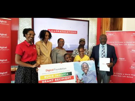 Jodi-Ann McFarlane, senior operations manager at Digicel Foundation; Marie Hall, project manager, Lewisburgh Primary and Infant School; Milicent Buchanan, deputy board chair,  Lewisburgh Primary and Infant School; students Kevon Parkes and Kaylee Atkinson;