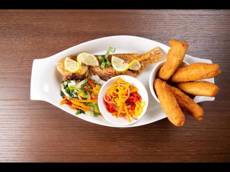 Escovitch fish is a staple of the Jamaican cuisine available that One Love Jamaican Restaurant prepares it to perfection.