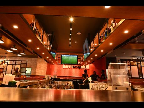 TGI Fridays’ updated bar and gantry adds a more open and inviting feel to the restaurant.