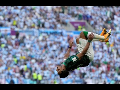 Saudi Arabia’s Salem Al-Dawsari celebrates after scoring his side’s second goal during the World Cup group C football match against Argentina at the Lusail Stadium in Lusail, Qatar yesterday.