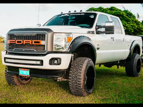 Ford 4 x 4 mini monster truck with white paint job. 