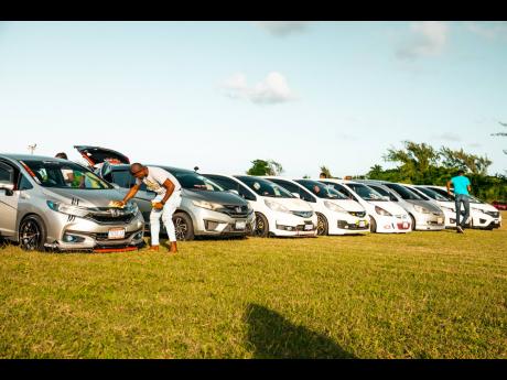 Cars lined up and ready for inspection for patrons. 