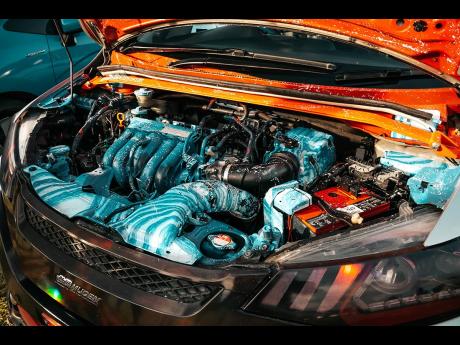 Custom paint engine bay highlighted with an immaculate aquamarine mix.