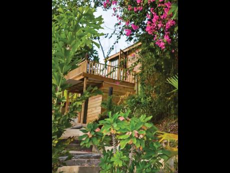 
This wooden hillside cottage with its captivating outdoor setting leaves you speechless.