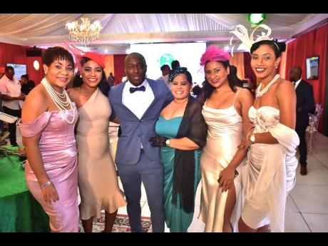 Jason Martinez (third), is a lucky man among beauties (from left) Karen Mitchell, Christine Benjamin, René Mitchell, Rachel Kirlew and
 Kristen Raymore-Reynolds. 