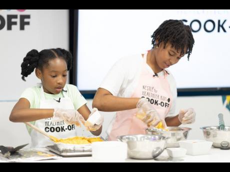 Pilar Silvera (right) is busy at work during the team challenge with fellow contestant Summer Harris.