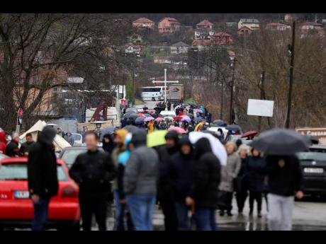 Local Serbs block the road near the village of Rudare, north of Serb-dominated part of ethnically divided town of Mitrovica, Kosovo.