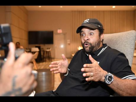 Orville 'Shaggy' Burrell speaking with journalists at AC Hotel shortly after conducting a walk-through of Bustamante Hospital for Children on Monday. 
