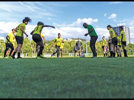 Lorne Donaldson, the assistant coach at the FIFA Women’s World Cup  in 2019, joins Reggae Girlz  in training drills at a session at Stade Eugene Thenard in Grenoble, France on Sunday, June 16, 2019 ahead of the Group C match against Australia. 